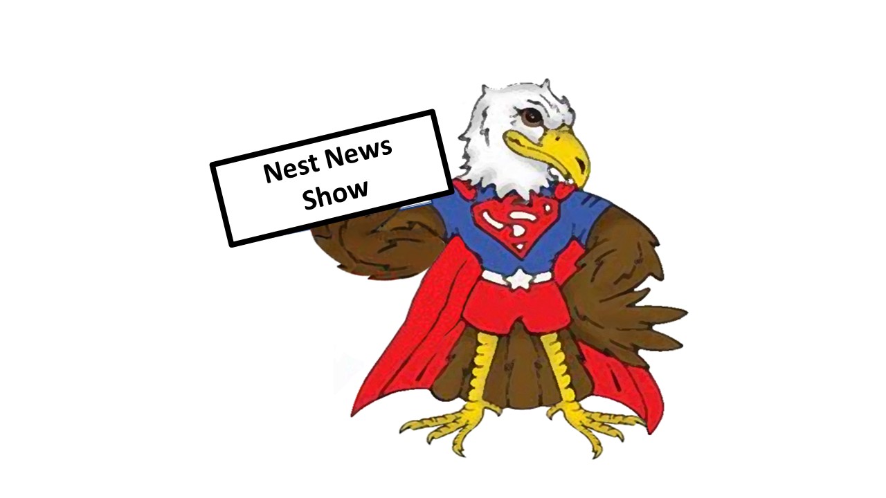 Emmett holding "Nest News Show" sign